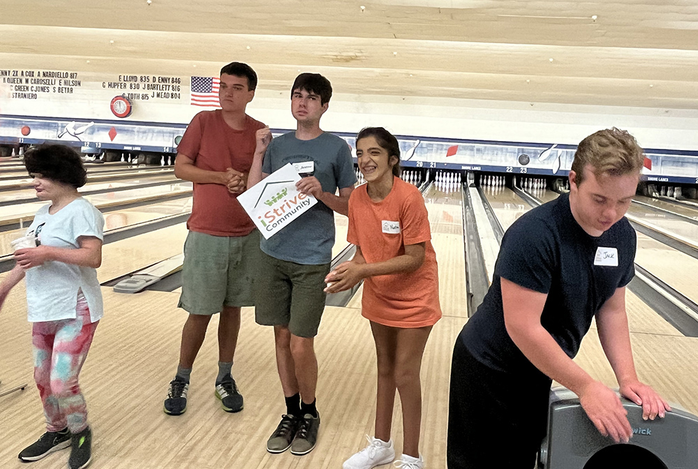 People with special needs at the iStrive Community's "Friday Night Bowling and Pizza" event.