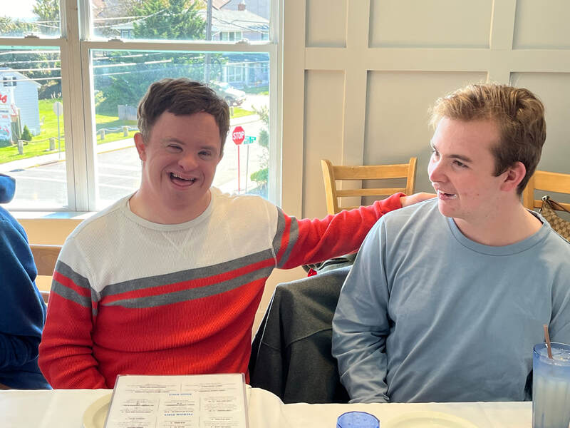 Two people with special needs at an iStrive Community event.