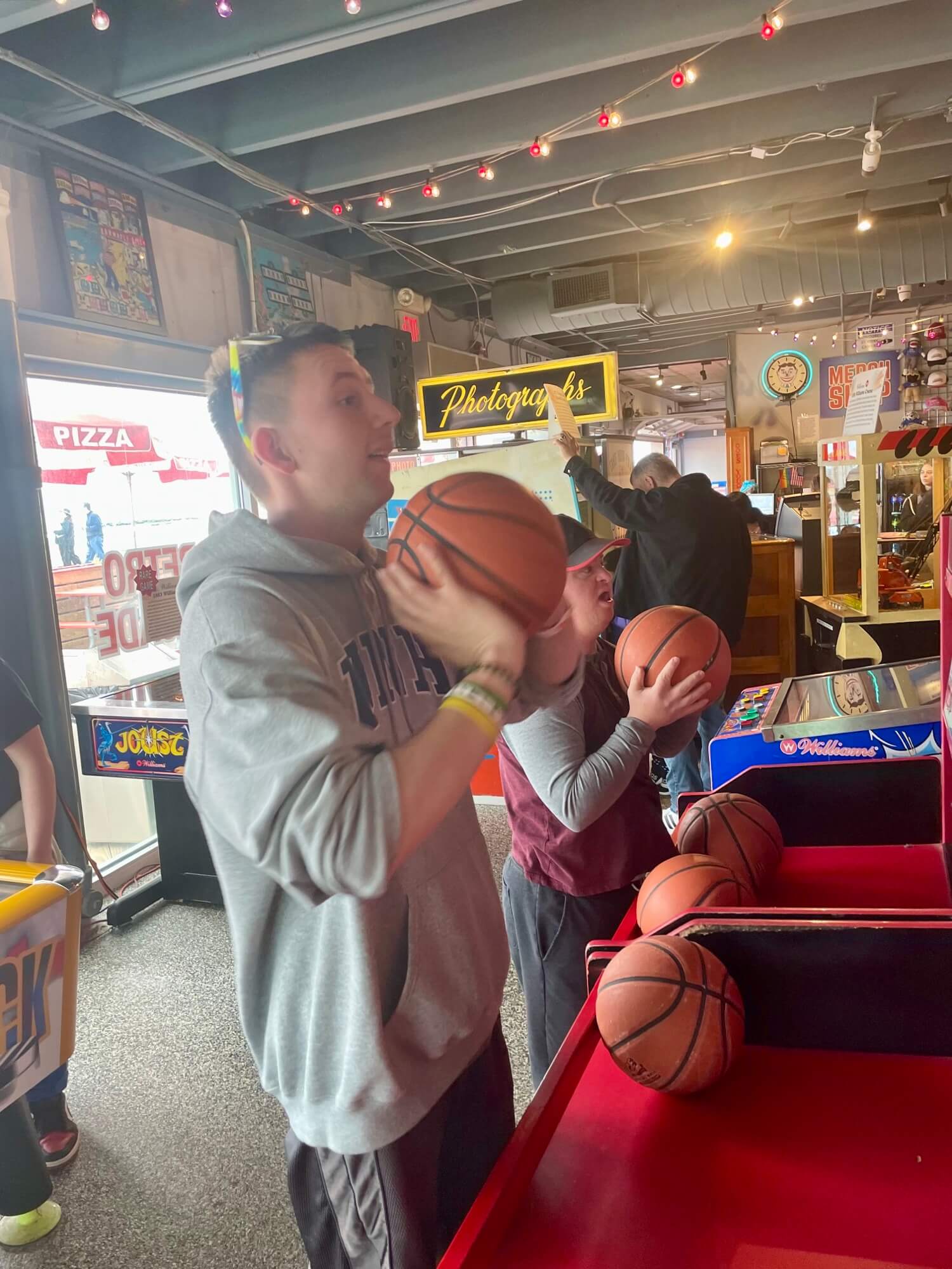 People with special needs at the iStrive Community's "Havin' a Ball at Silver Ball Arcade" event.