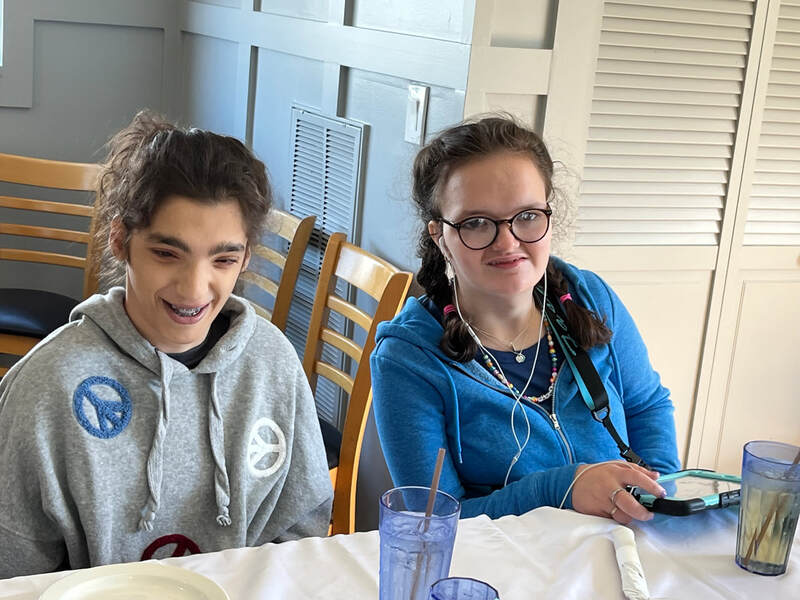 Two people with special needs at an iStrive Community event.