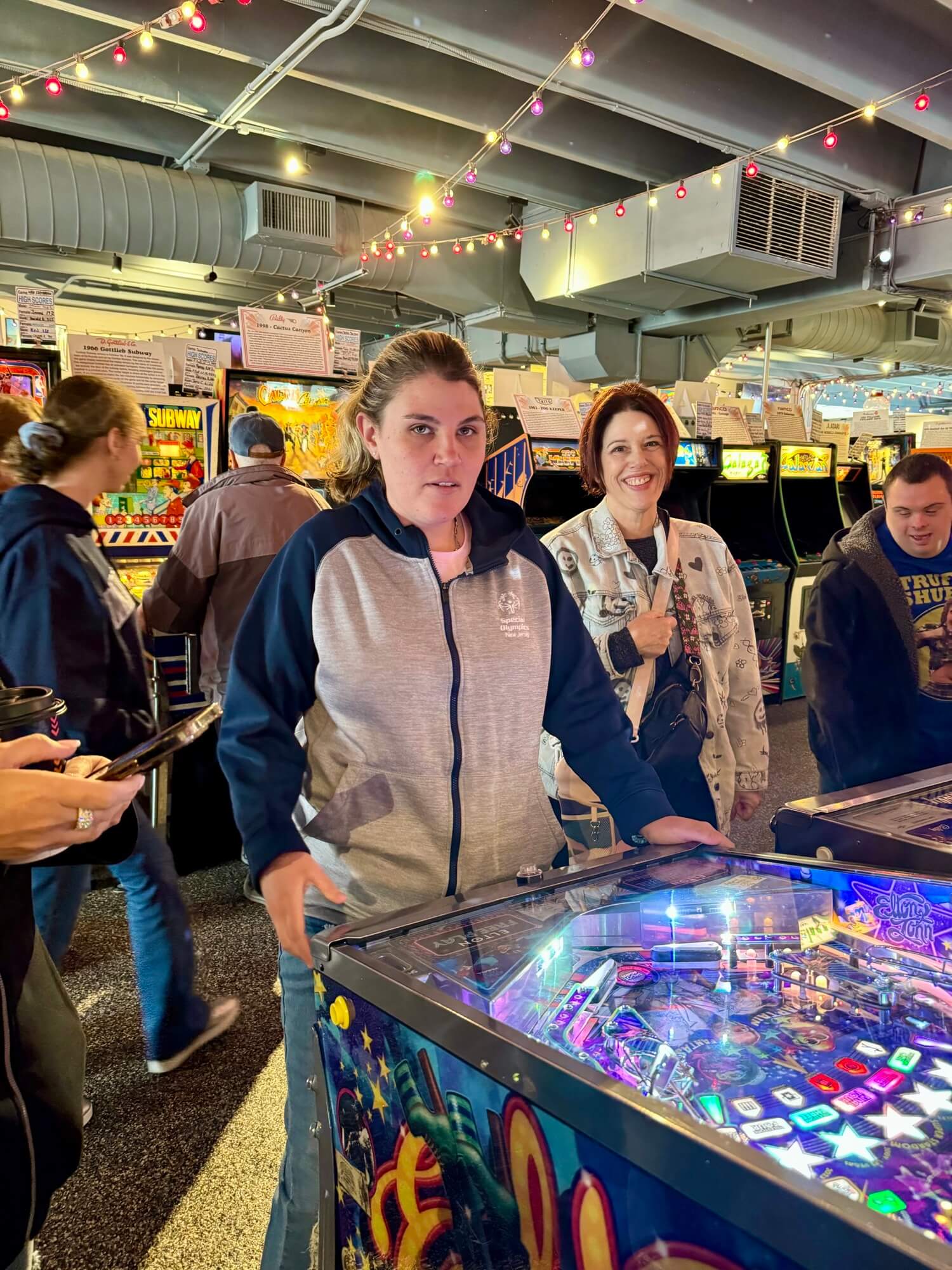 People with special needs at the iStrive Community's "Havin' a Ball at Silver Ball Arcade" event.