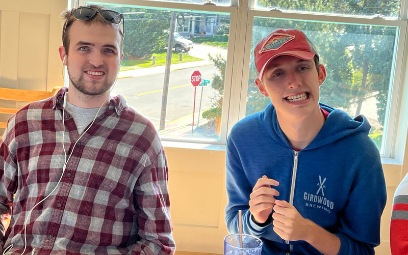 Two people with special needs at an iStrive Community event.