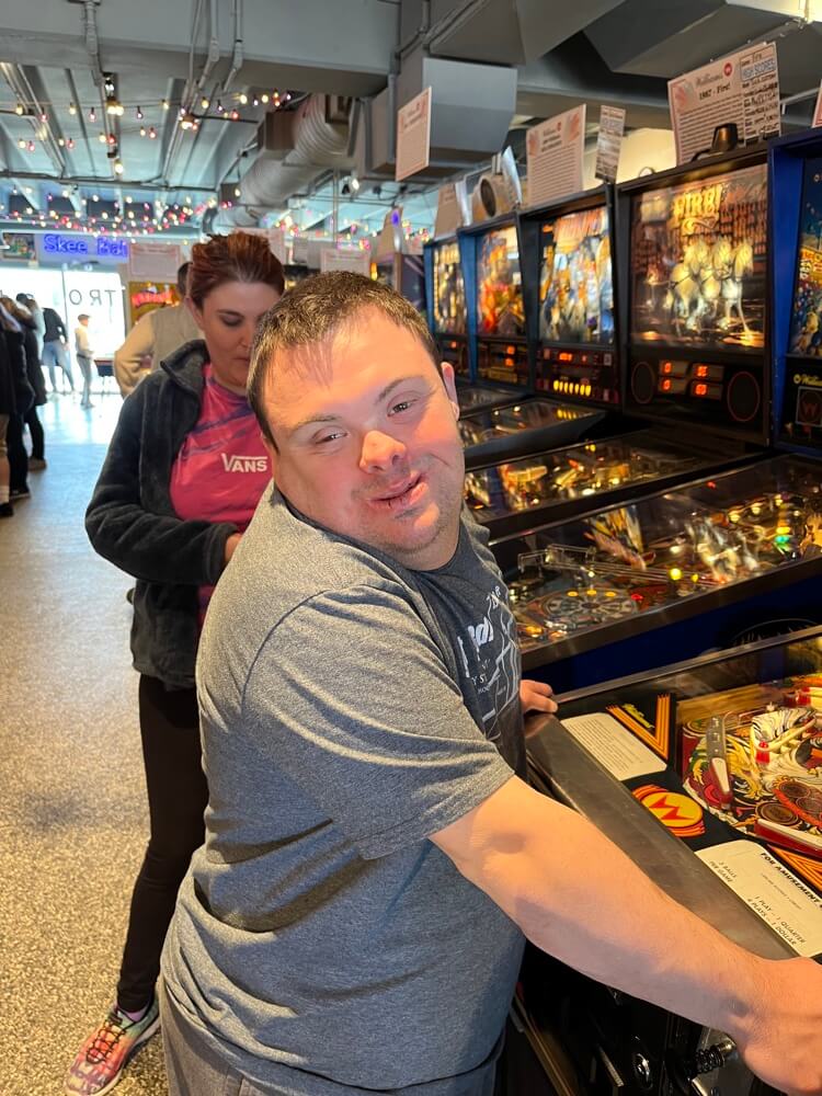 People with special needs at the iStrive Community's "Silverball Arcade" event.