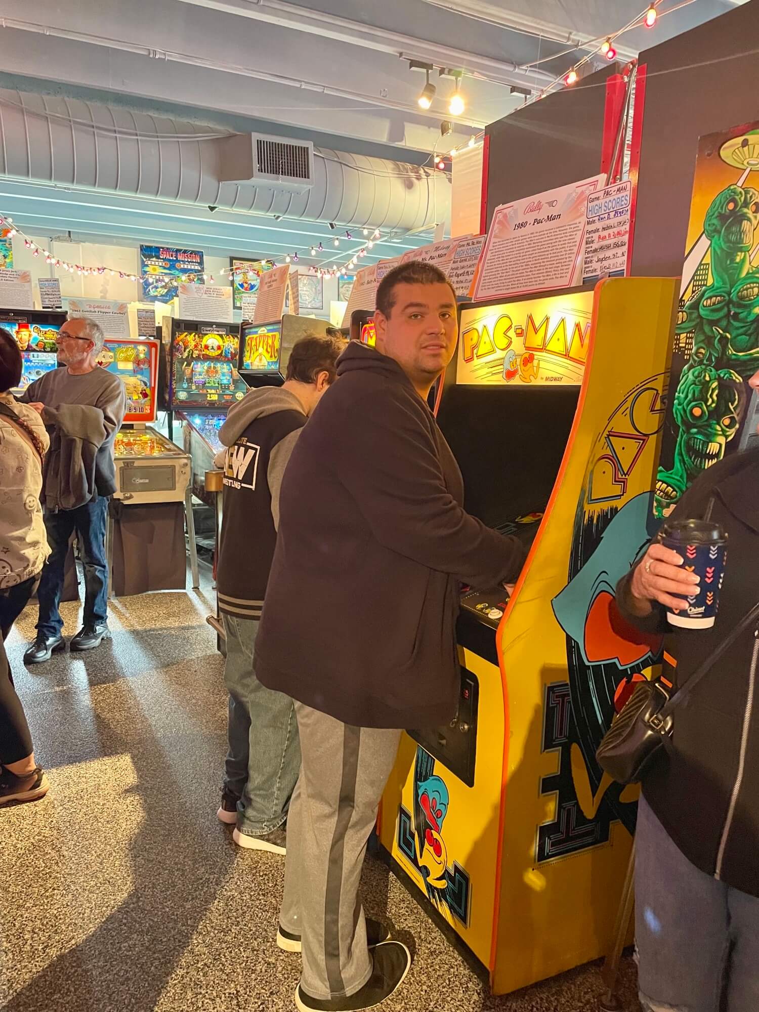 People with special needs at the iStrive Community's "Havin' a Ball at Silver Ball Arcade" event.