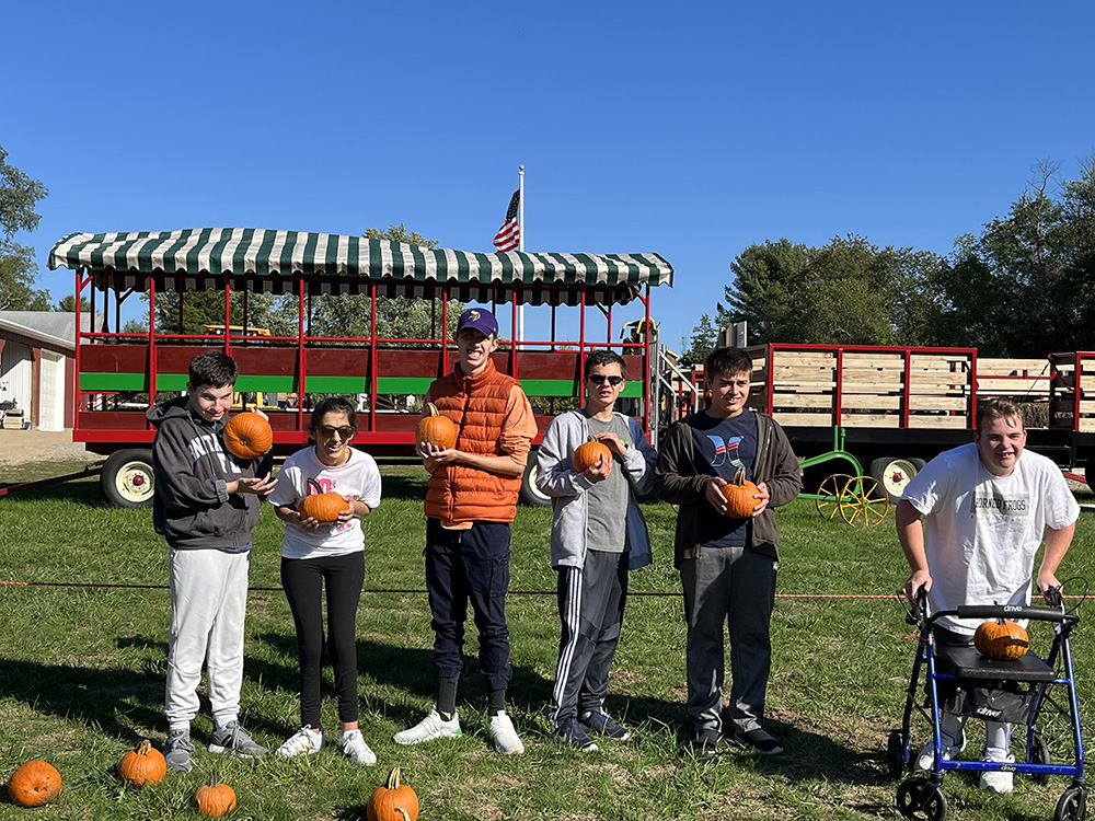 People with special needs at the iStrive Community's "Allaire Community Farm" event.