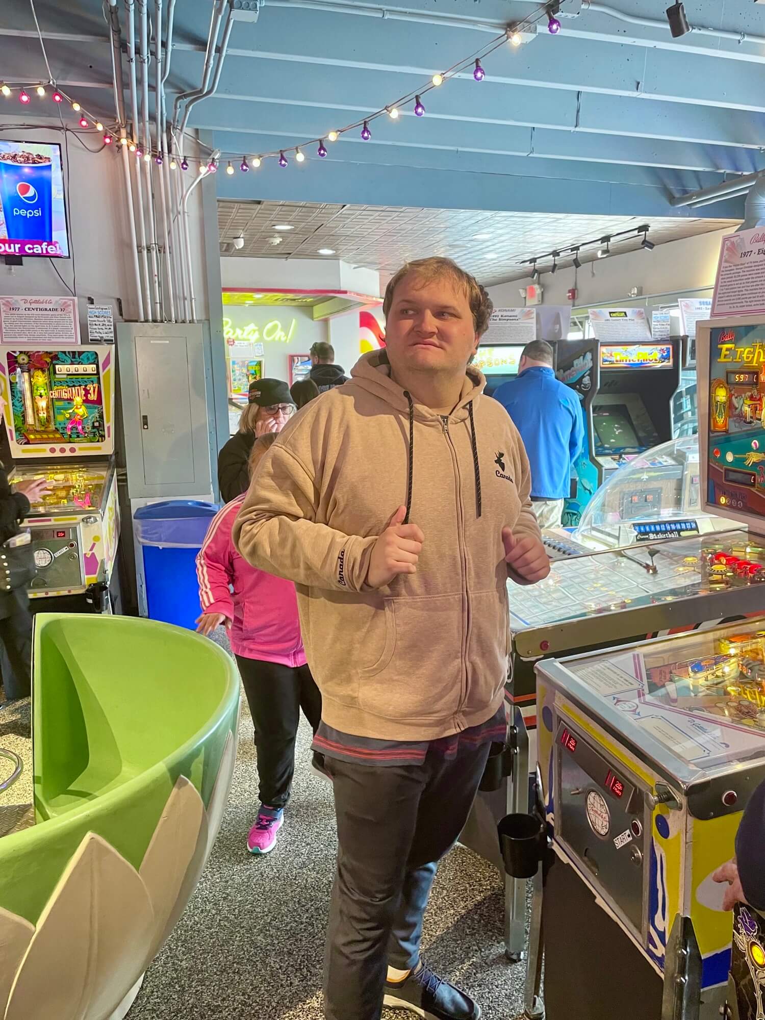 People with special needs at the iStrive Community's "Havin' a Ball at Silver Ball Arcade" event.