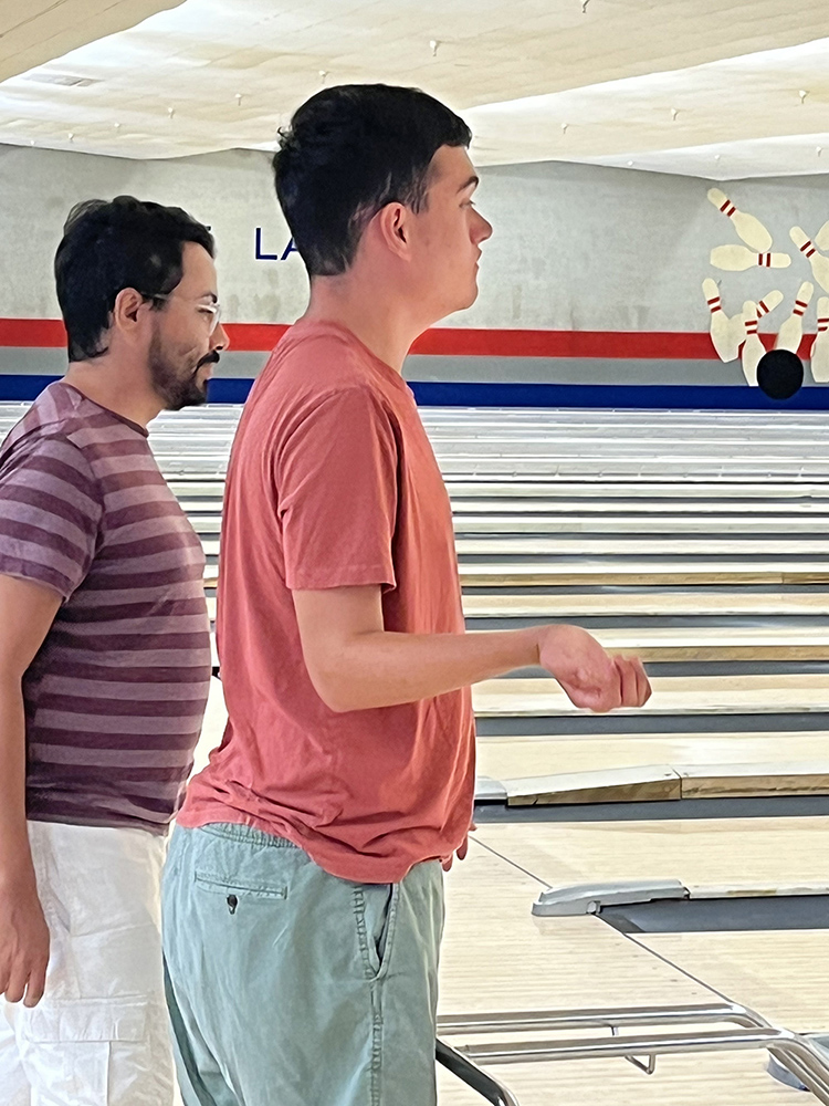 People with special needs at the iStrive Community's "Friday Night Bowling and Pizza" event.