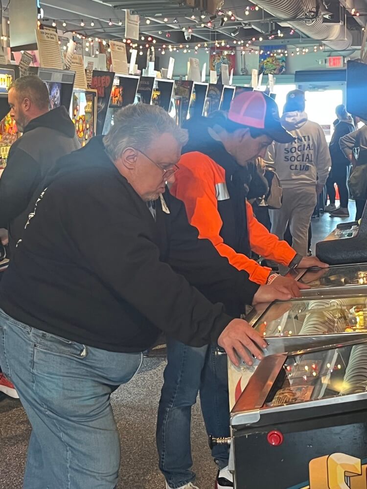 People with special needs at the iStrive Community's "Silverball Arcade" event.