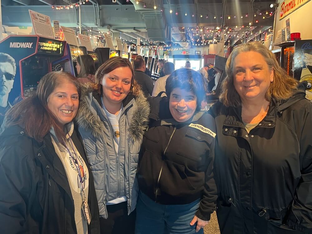 People with special needs at the iStrive Community's "Silverball Arcade" event.