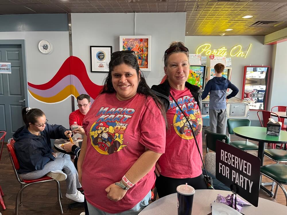 People with special needs at the iStrive Community's "Silverball Arcade" event.