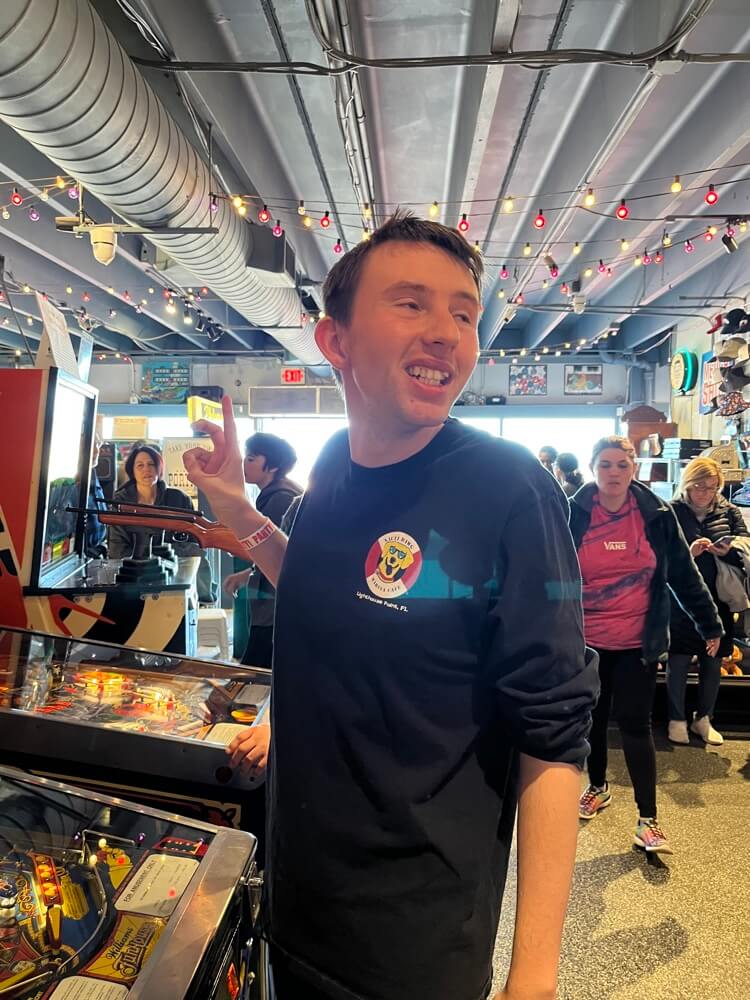 People with special needs at the iStrive Community's "Silverball Arcade" event.