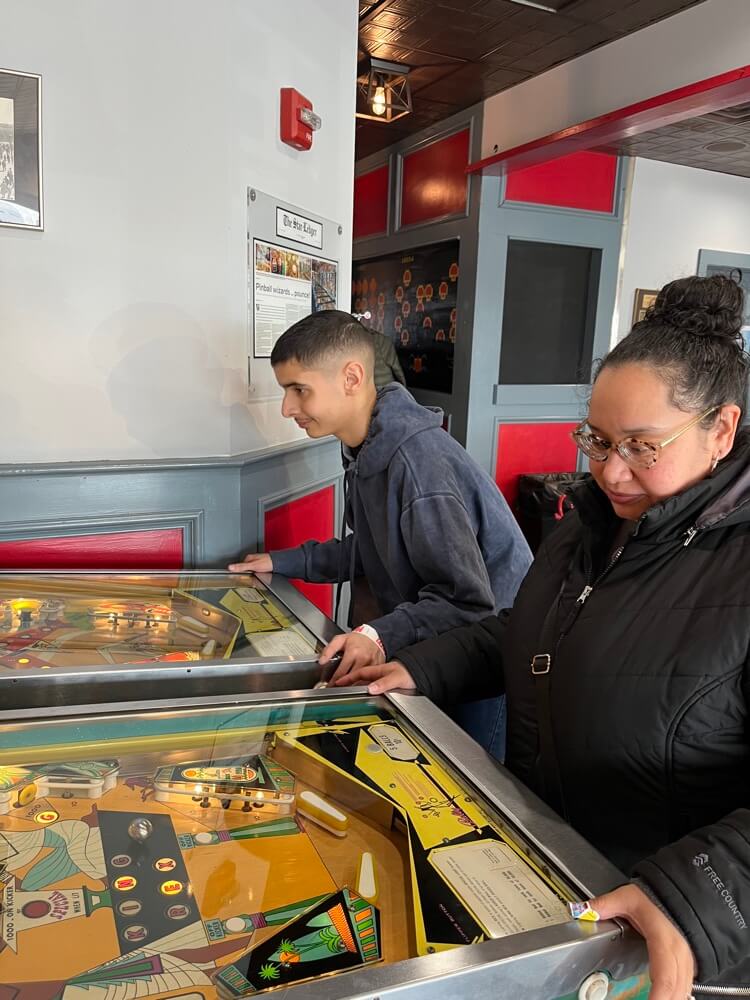 People with special needs at the iStrive Community's "Silverball Arcade" event.