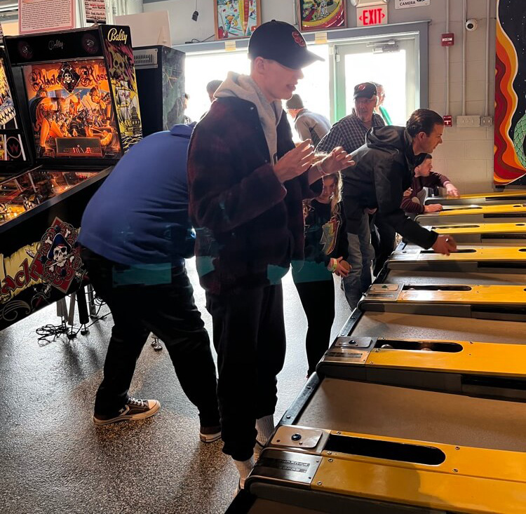 People with special needs at the iStrive Community's "Silverball Arcade" event.
