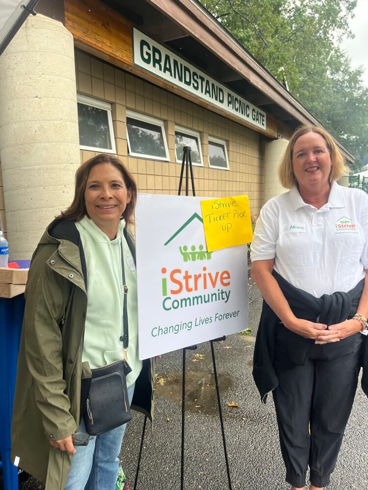 Members of iStrive Community at a racehorse event.