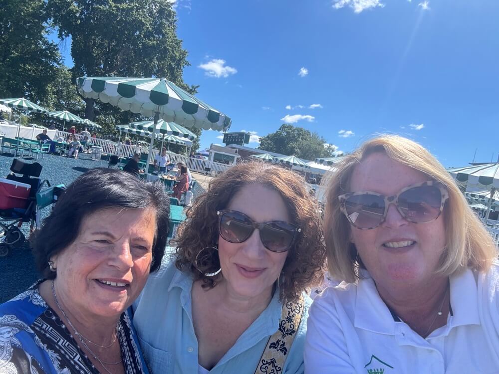 Members of iStrive Community at a racehorse event.