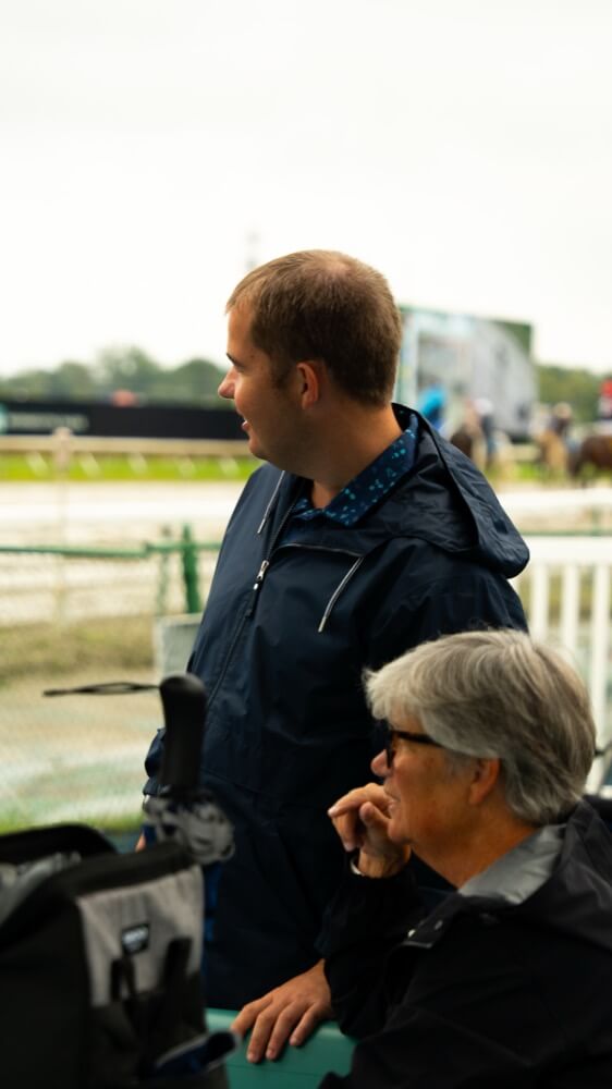 People with special needs at a racehorse event.