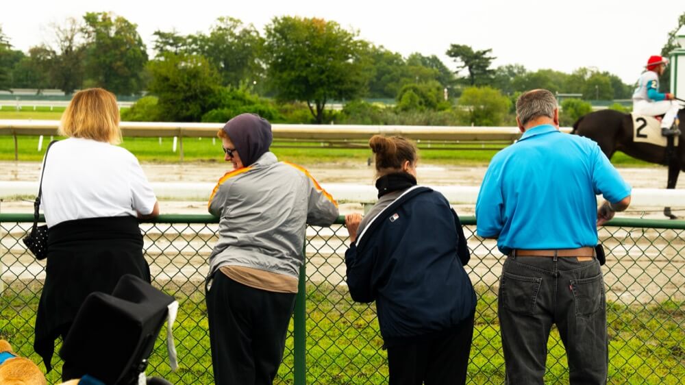 People with special needs at a racehorse event.